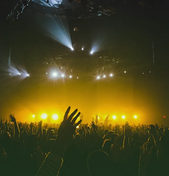 Production event audience with stage lighting