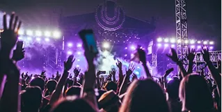 Live summer music festival with professional stage lighting and concert audience
